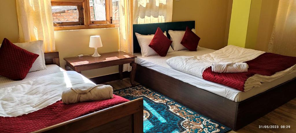 Postel nebo postele na pokoji v ubytování The Bliss Homestay