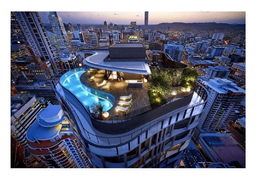 a building with a swimming pool on the top of it at Lux 37th floor 2br 2bath, Infinity pool, Gym, Wifi in Brisbane