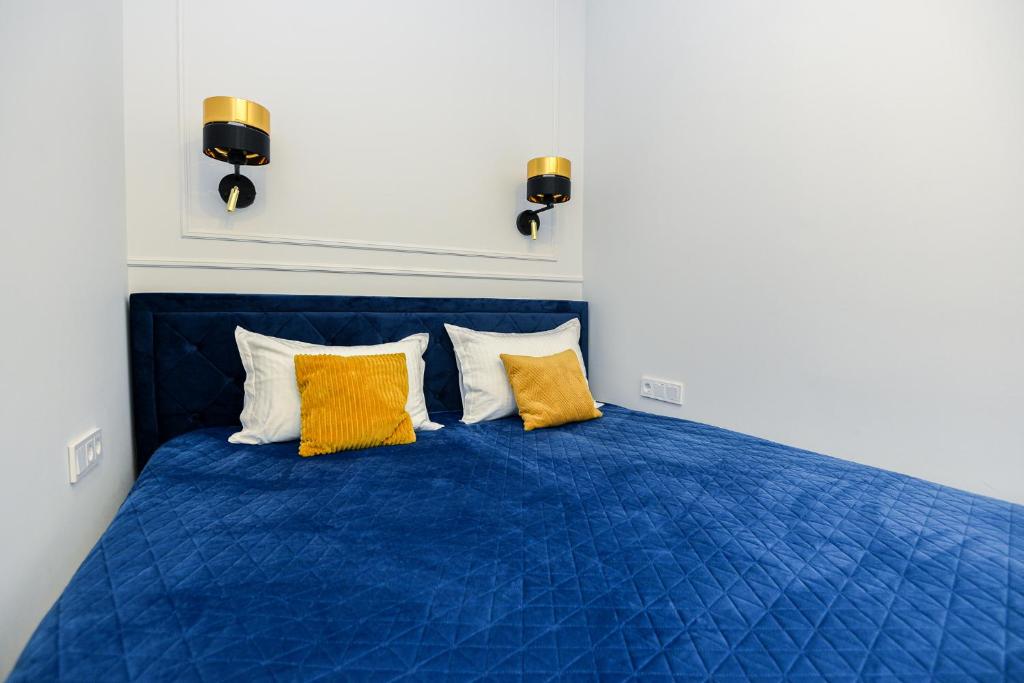 Кровать или кровати в номере Nida family apartments