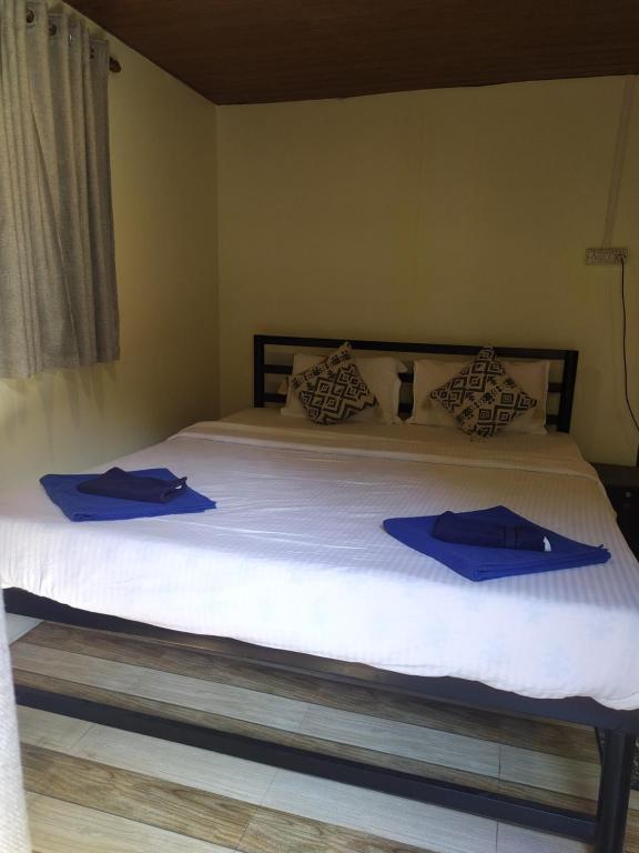 Postel nebo postele na pokoji v ubytování Palm Trees Ayurvedic Heritage