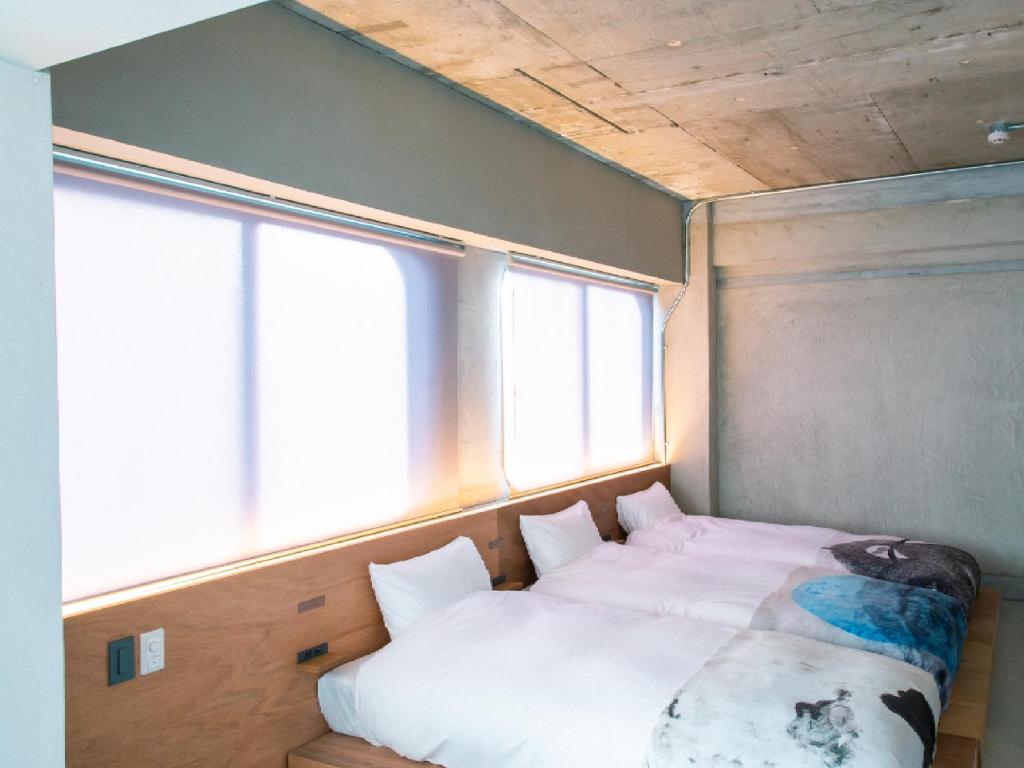 Postel nebo postele na pokoji v ubytování Kagan Hotel & Hostel