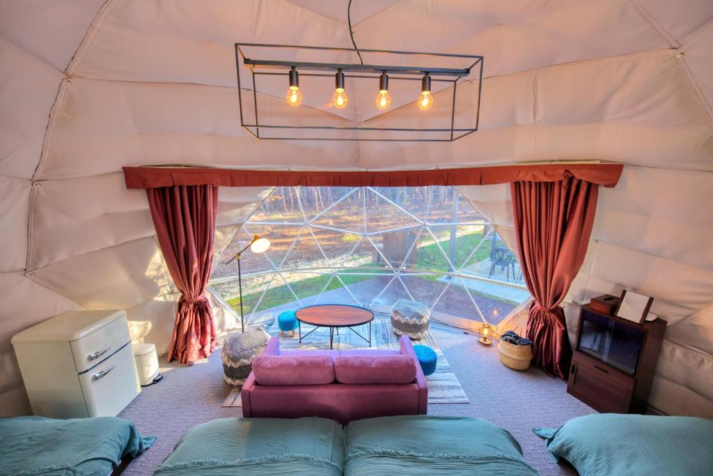 Letto o letti in una camera di HOSHIFULL DOME FUJI