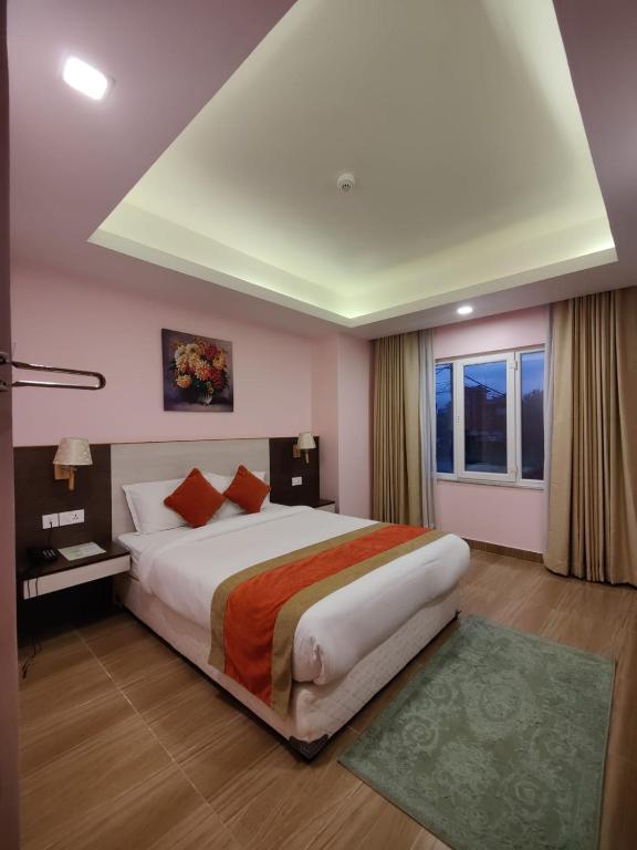 Postel nebo postele na pokoji v ubytování Hotel Krishna Kathmandu