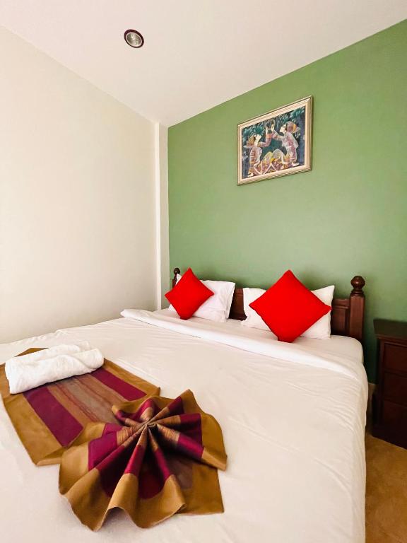 Postel nebo postele na pokoji v ubytování Meewaya Hotel