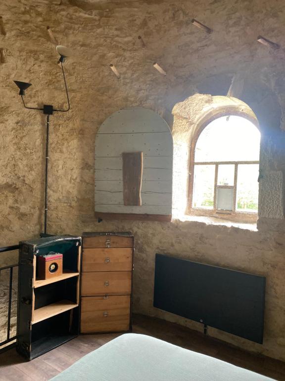 Postel nebo postele na pokoji v ubytování Le Colombier de Malpas