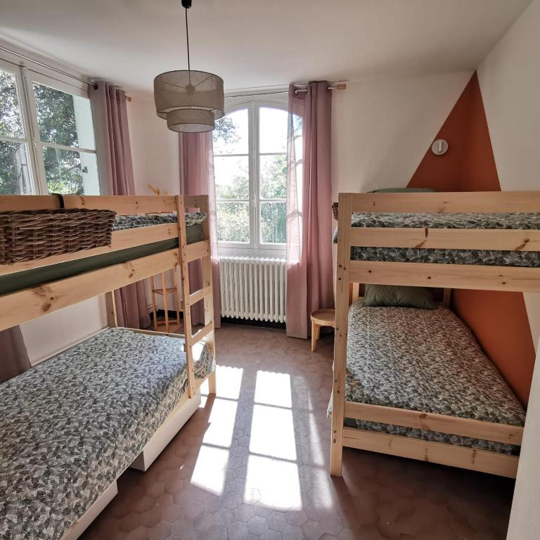Posteľ alebo postele v izbe v ubytovaní « Villa l’Enclos »