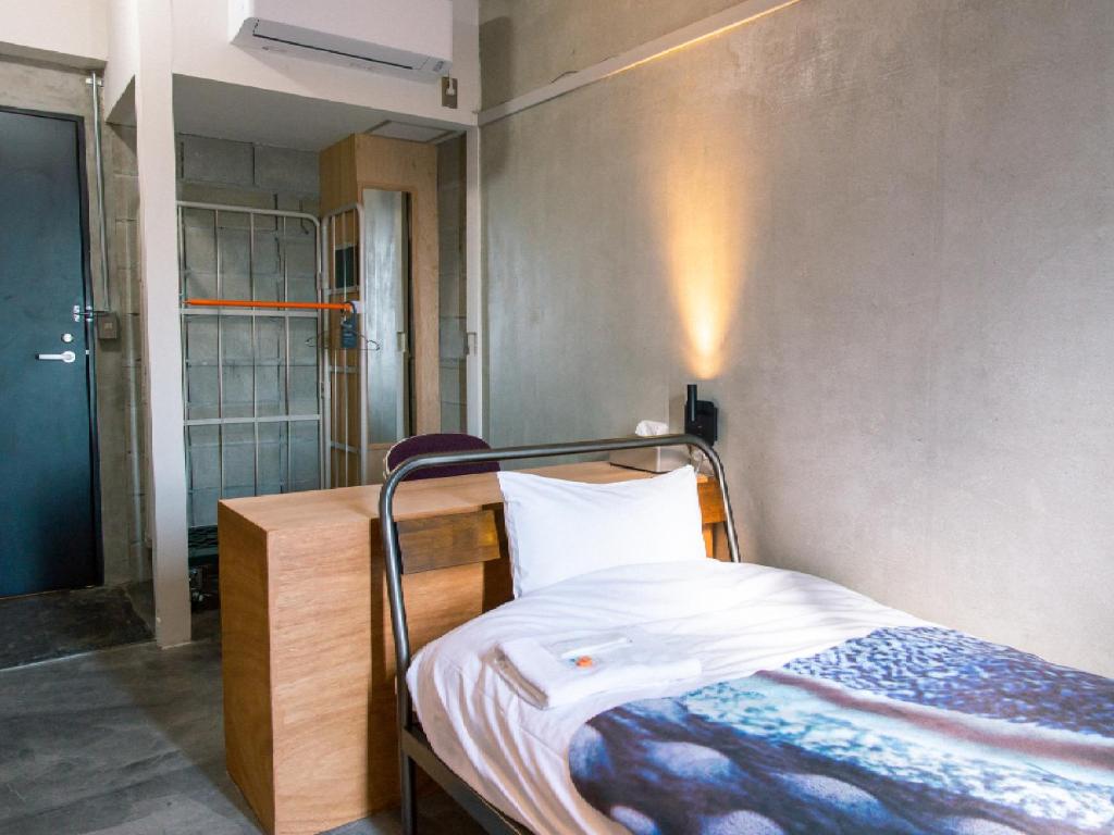 Postel nebo postele na pokoji v ubytování Kagan Hotel & Hostel