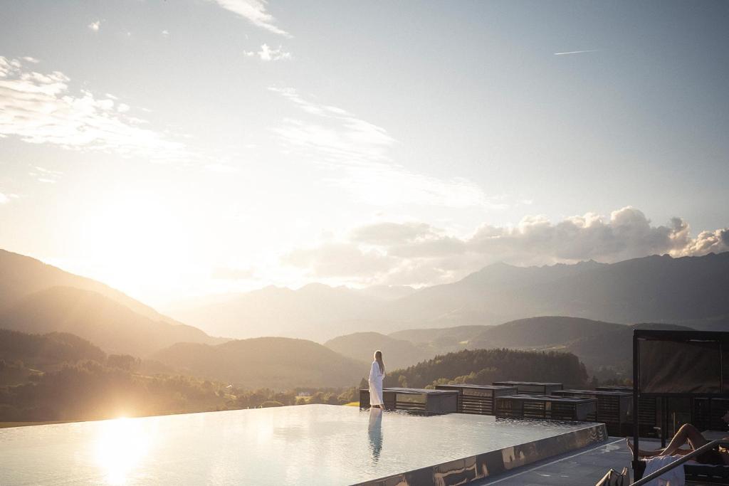 a person standing on the edge at Hotel Winkler Sport & Spa Resort in San Lorenzo di Sebato