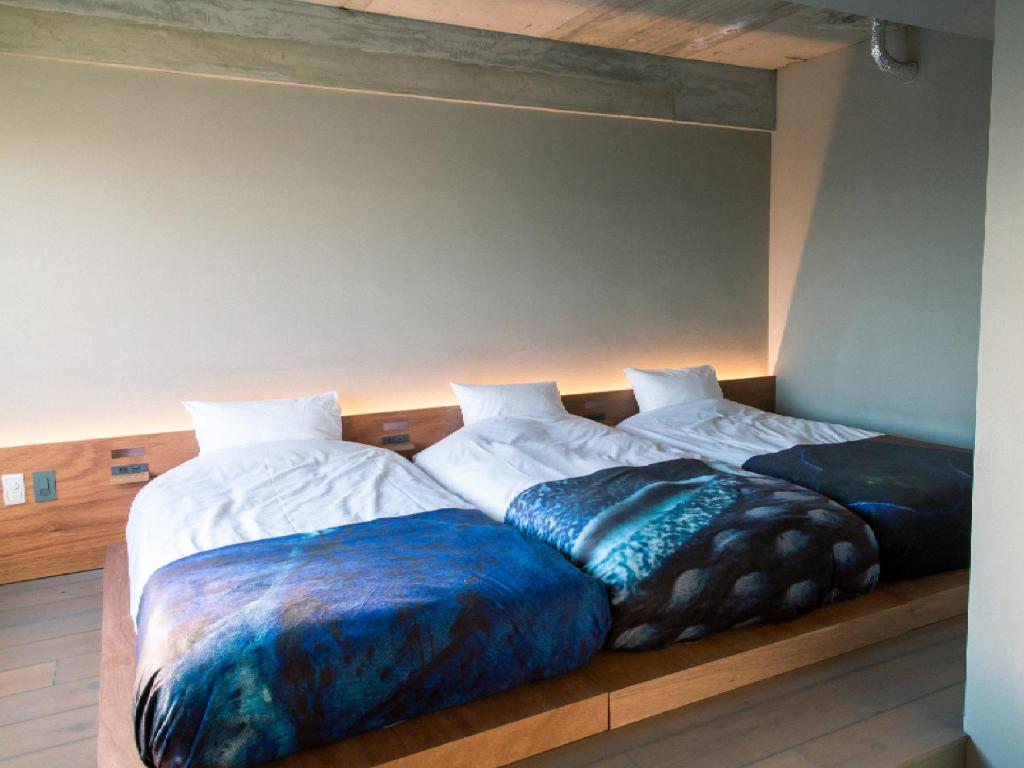 Postel nebo postele na pokoji v ubytování Kagan Hotel & Hostel