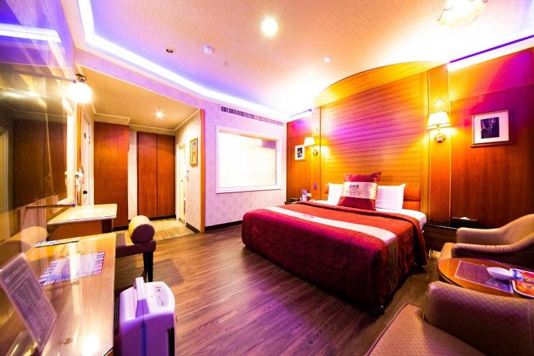 Postel nebo postele na pokoji v ubytování Wen Sha Bao Motel-Xinying