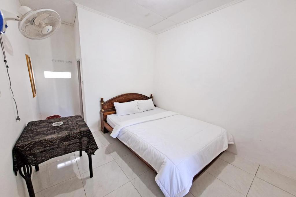 Giường trong phòng chung tại SPOT ON 92412 Homestay Eka Fortuna Ranau