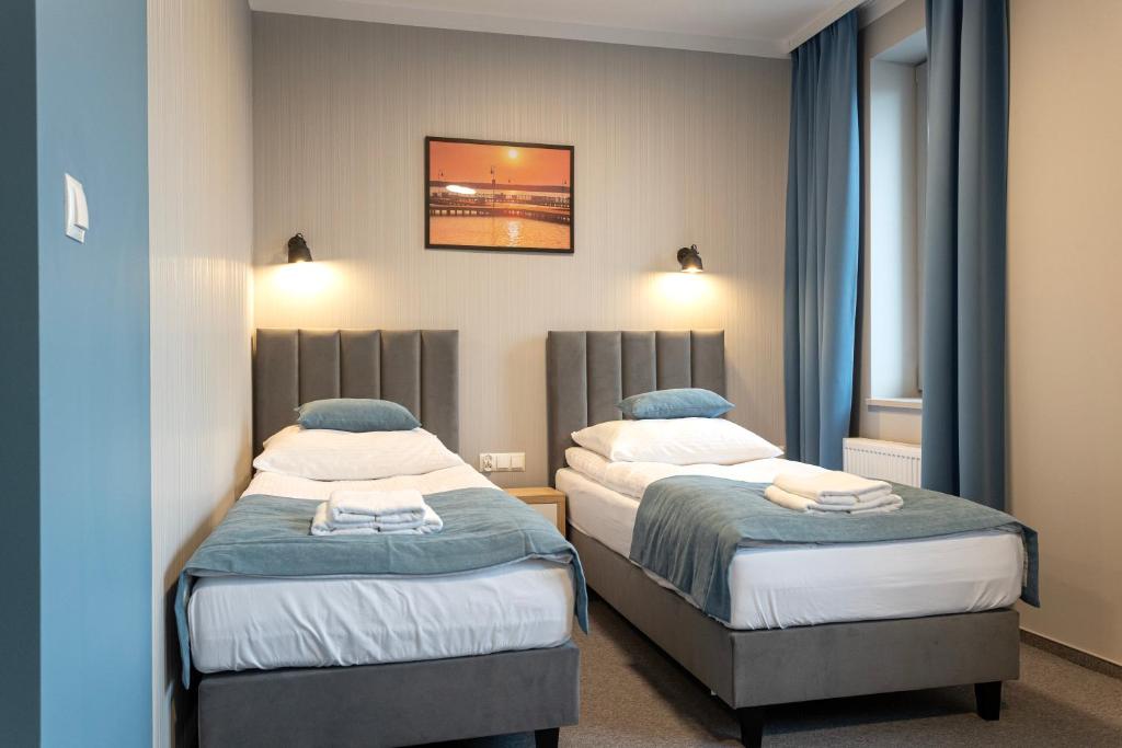 Postel nebo postele na pokoji v ubytování Apartamenty Albatros