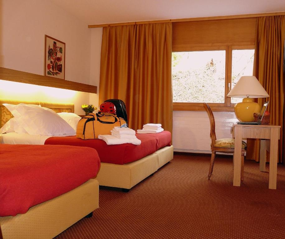 Postel nebo postele na pokoji v ubytování Hôtel de la Forêt