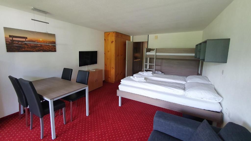 TV a/nebo společenská místnost v ubytování Apart Holidays - Haus Acletta