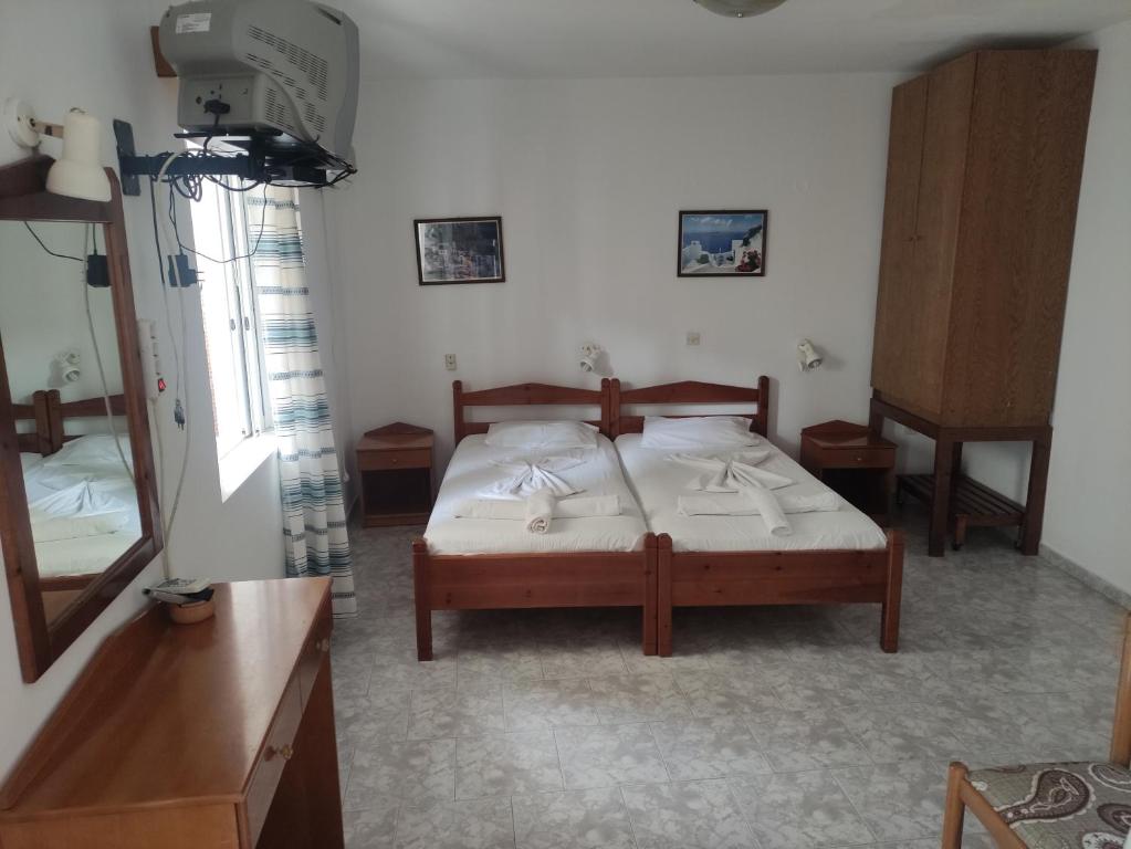 Postel nebo postele na pokoji v ubytování Roses Studios