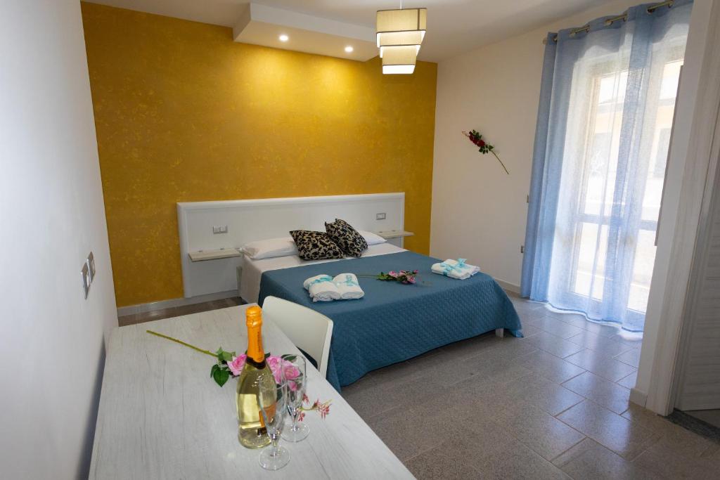 A bed or beds in a room at B&B L'Oasi