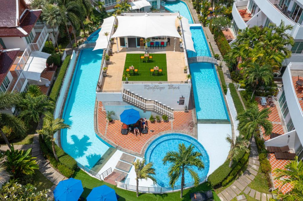 an overhead view of the pool at the resort at Phunawa Resort Phuket Karon Beach - SHA Plus in Karon Beach