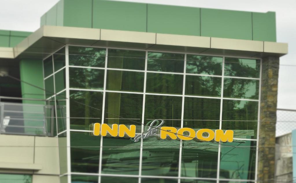 a building with an amazon sign on the side of it at Inside Room Inn in Tagum