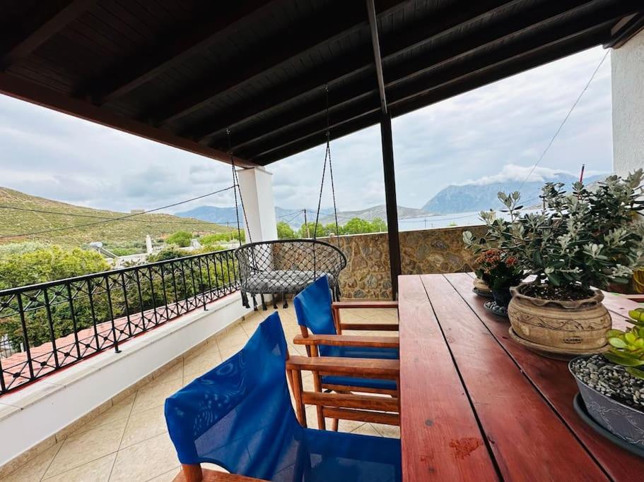 a table and chairs on a balcony with a view at Your perfect escape in Emporios! in Kalymnos