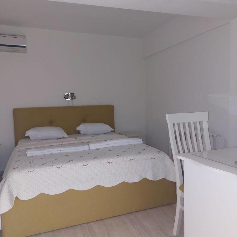 Postel nebo postele na pokoji v ubytování Hotel Florentina