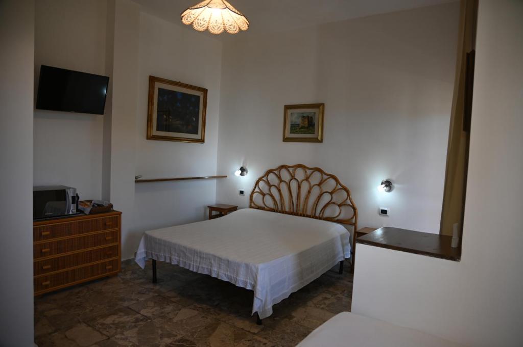 Postel nebo postele na pokoji v ubytování B&B Villa Dongiovanni