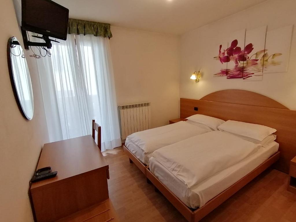 Postel nebo postele na pokoji v ubytování Hotel Denny