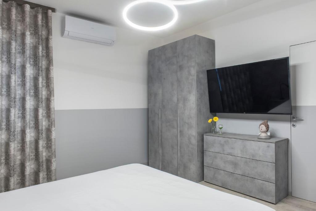 TV a/nebo společenská místnost v ubytování PETIT casa vacanze