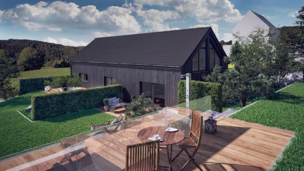 a rendering of a backyard with a wooden table and a barn at Chalet Young & Fun in Freyung