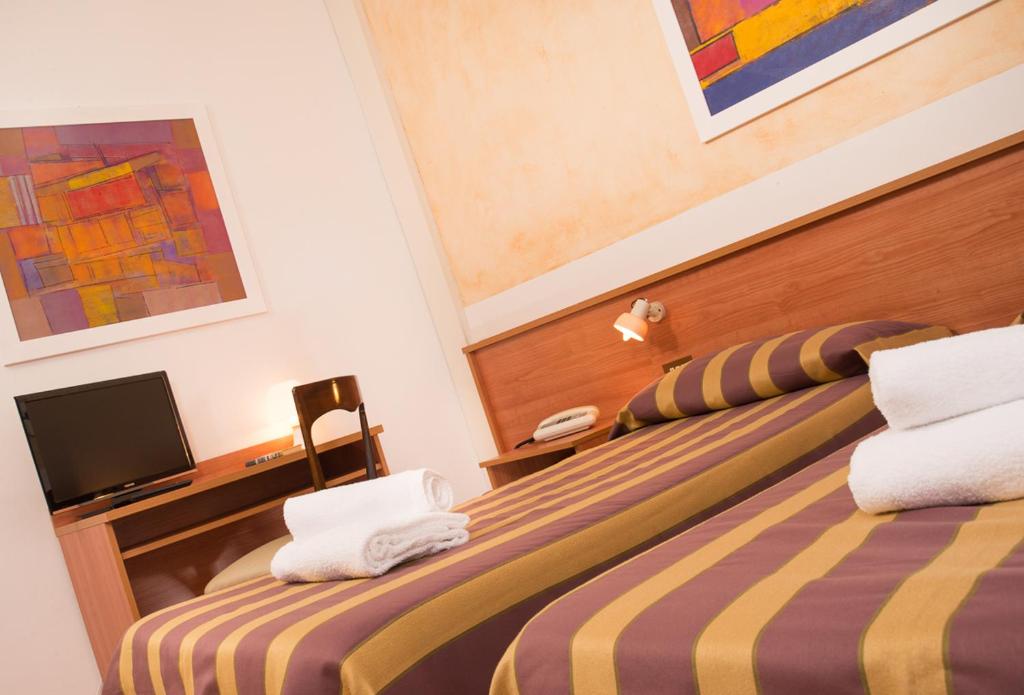 Postel nebo postele na pokoji v ubytování Hotel Antille e Azzorre