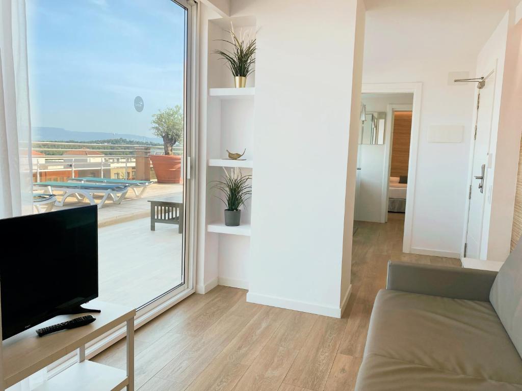 TV a/nebo společenská místnost v ubytování Aparthotel SunClub Salou