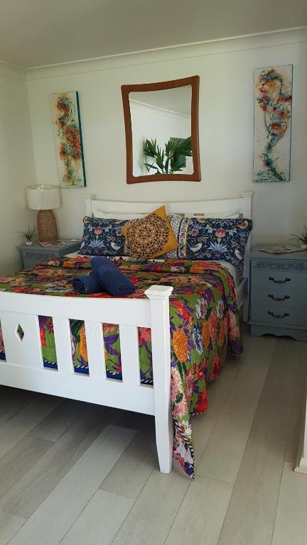 a bedroom with a bed with a white bed frame at Black Sheep Cottage Hay in Hay