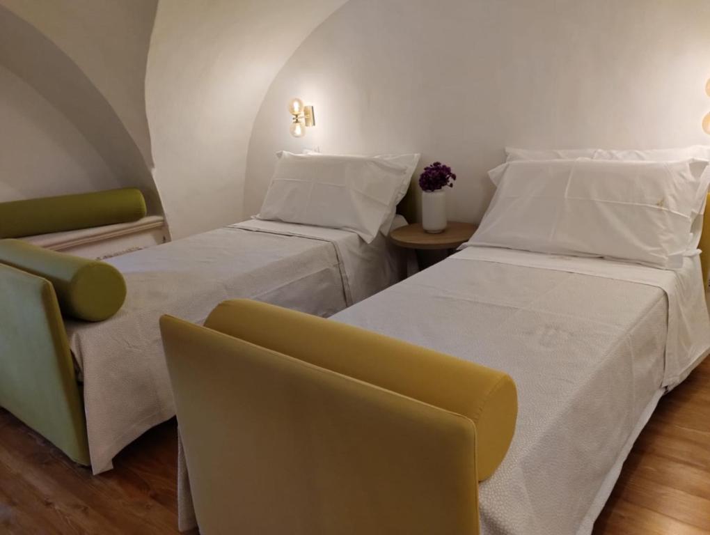 Postel nebo postele na pokoji v ubytování CASATA