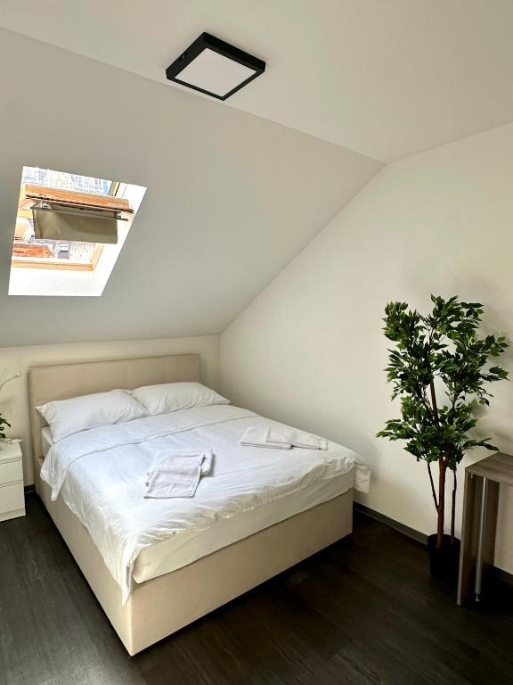 Postel nebo postele na pokoji v ubytování KAPTOL Rooms