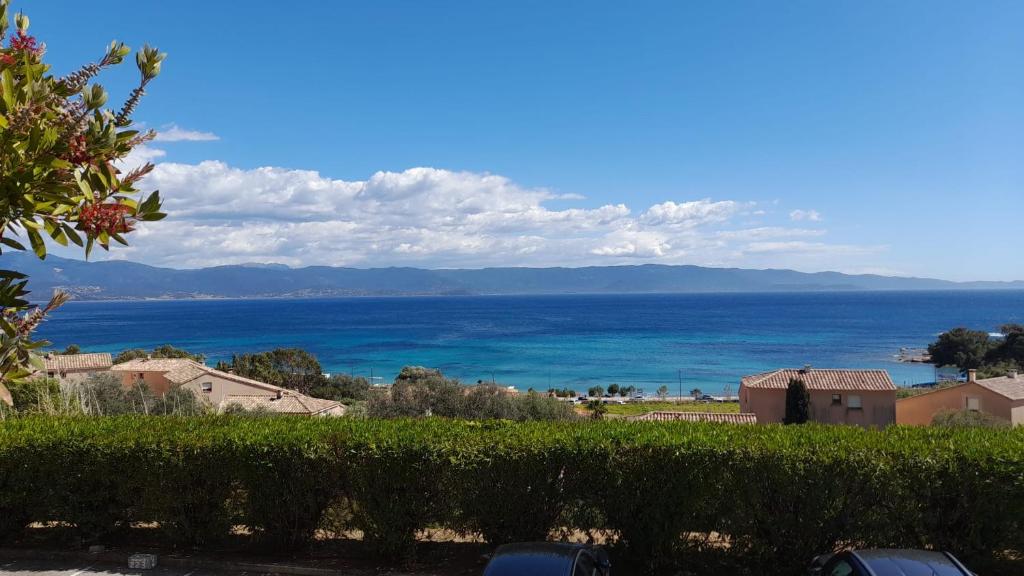 a view of the ocean from a house at Marinella, vue mer panoramique, superbe T2 plage à 150 m in Ajaccio