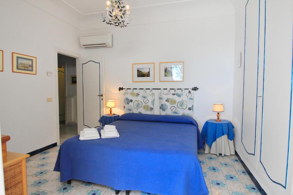 Postel nebo postele na pokoji v ubytování Casa Augusto B&B