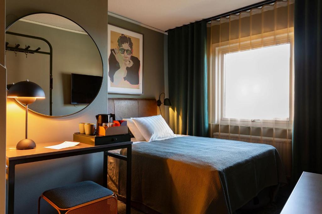Säng eller sängar i ett rum på Spar Hotel Gårda