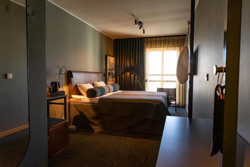 Postel nebo postele na pokoji v ubytování Spar Hotel Gårda