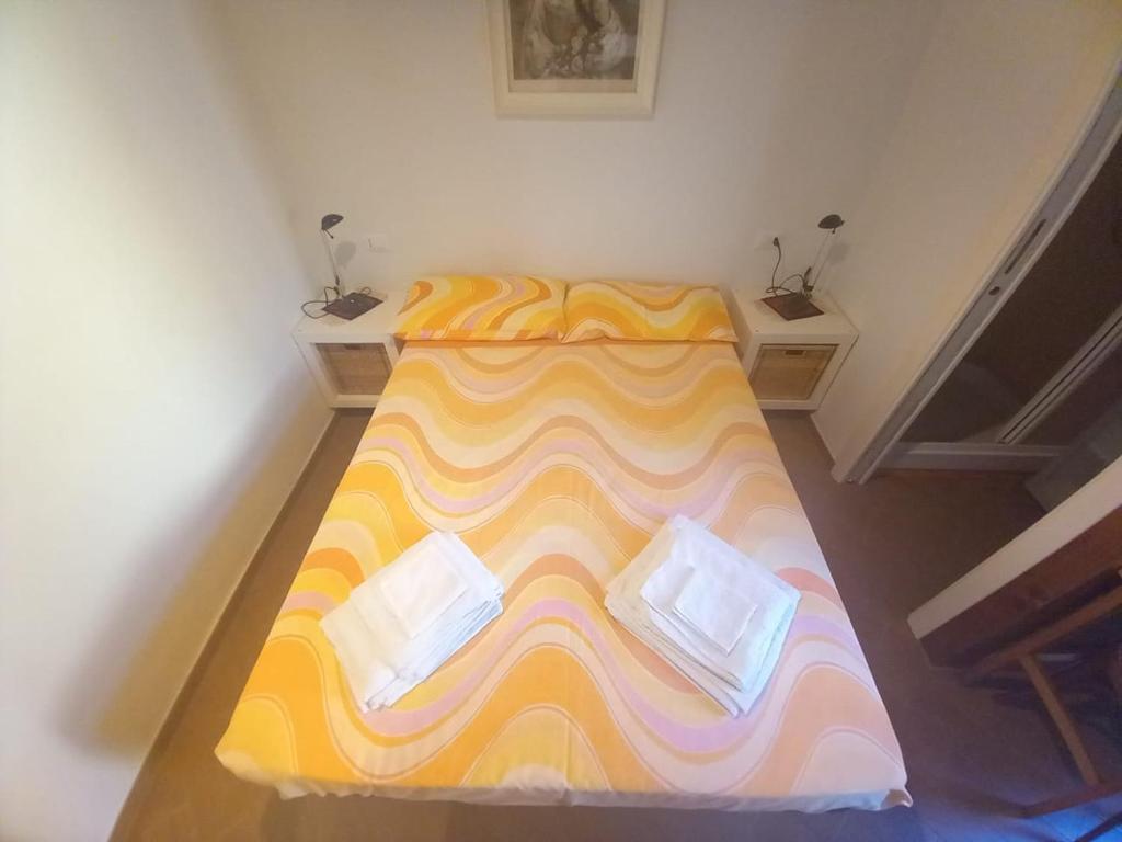 Postel nebo postele na pokoji v ubytování BIANCOFIORE Alloggio Turistico