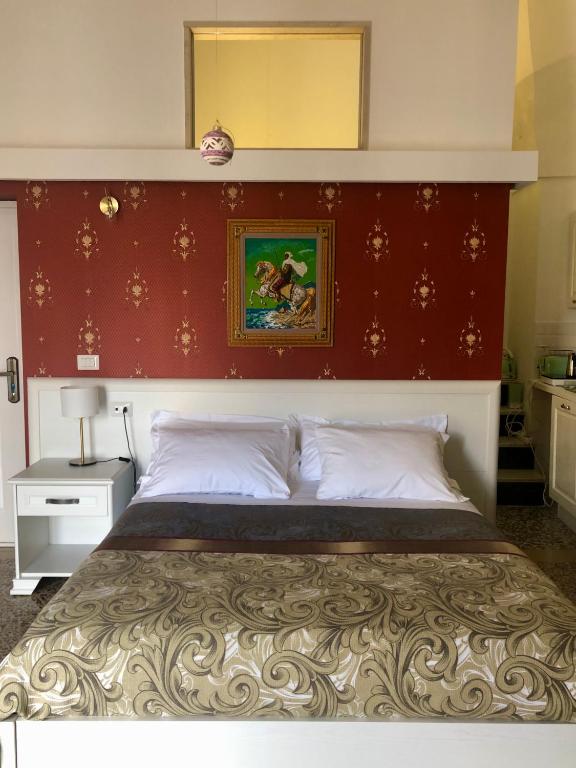 Postel nebo postele na pokoji v ubytování B&B dai Mimmi