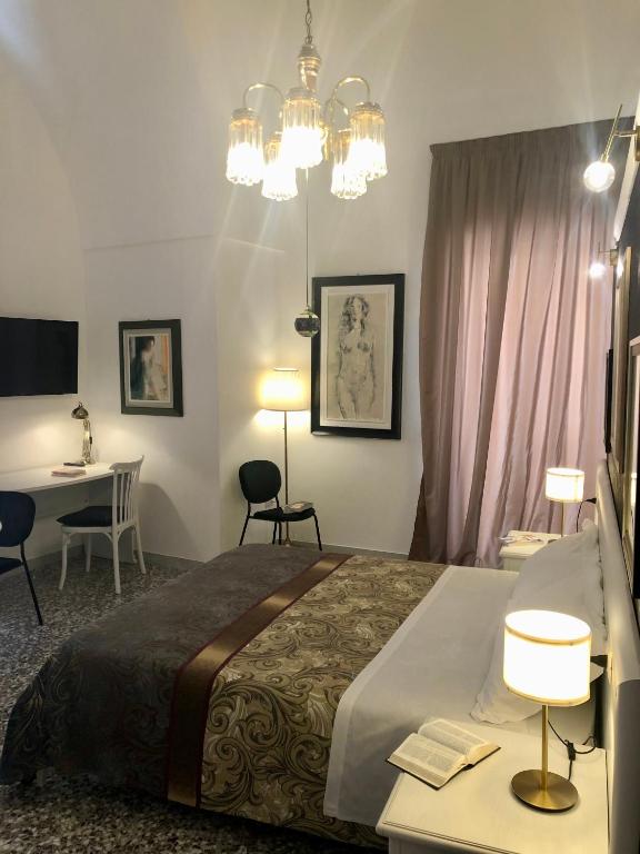 Postel nebo postele na pokoji v ubytování B&B dai Mimmi