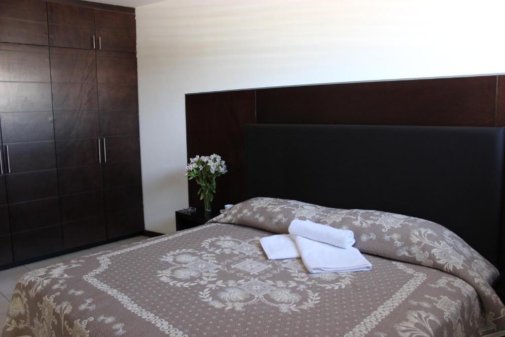 Postel nebo postele na pokoji v ubytování Hotel Ross