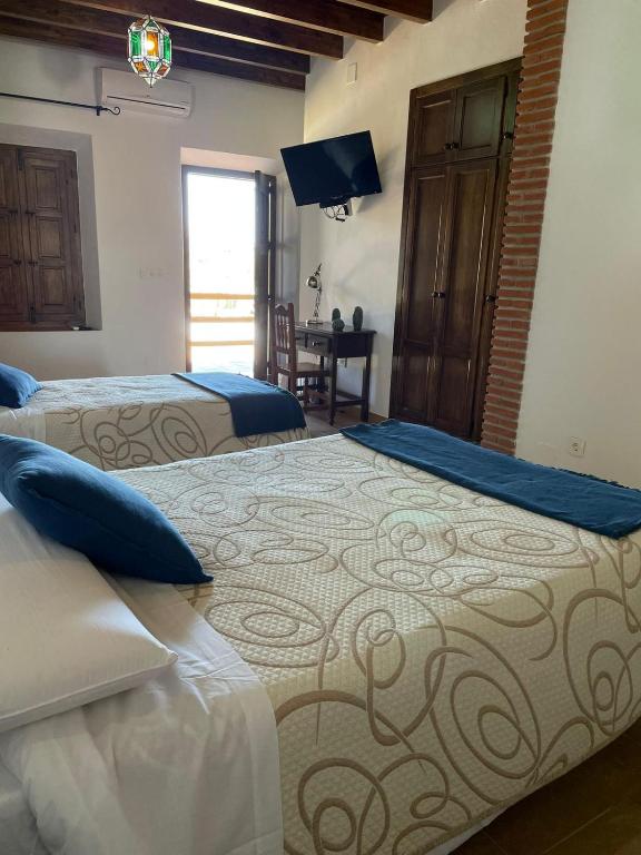 Posteľ alebo postele v izbe v ubytovaní Habitación rural en Posada Los Caballos