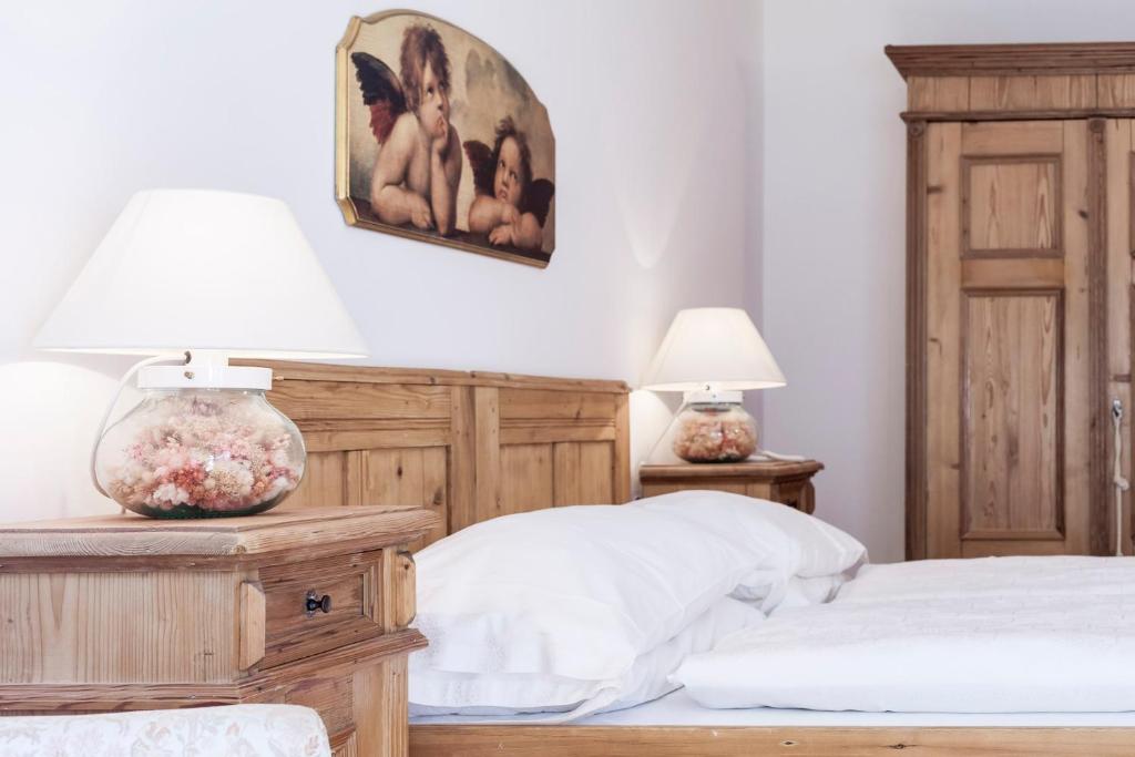 Postel nebo postele na pokoji v ubytování Hotel Bad Schörgau