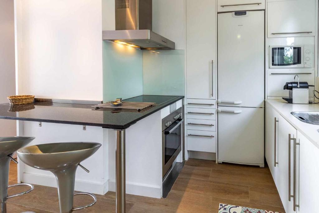 Kuchyň nebo kuchyňský kout v ubytování Urcatusa Migjorn 42 Apto 3 Dorm con piscina
