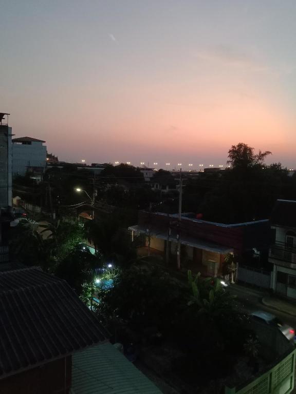 a sunset view of a city at night at Scpอพาร์ทเม้นท์ in Pak Kret