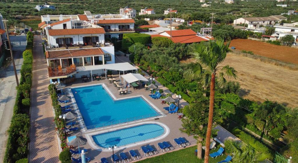 an aerial view of a house with a swimming pool at Despo Hotel in Gouves