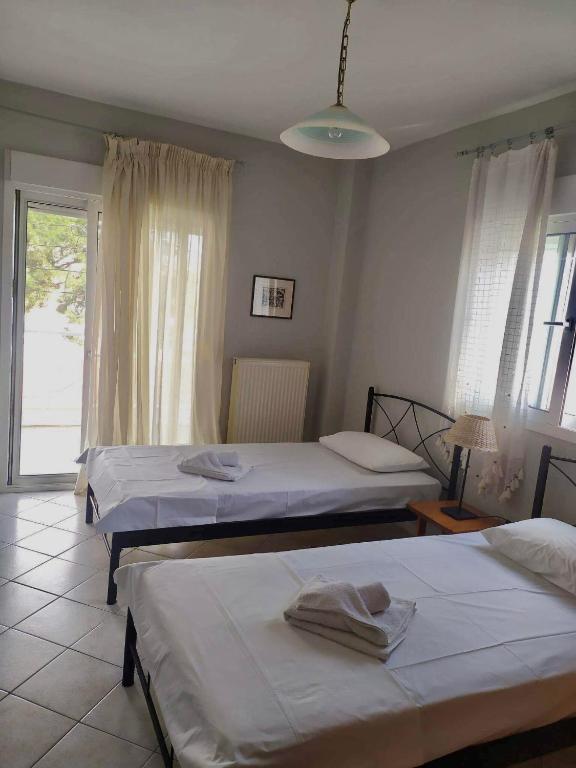 Postel nebo postele na pokoji v ubytování Mina Apartments 3 Nea Kallikrateia