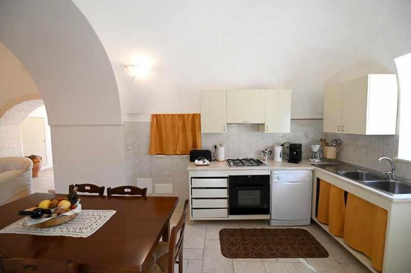 A kitchen or kitchenette at Trullo Antico with exclusive swimming pool
