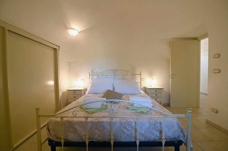 A bed or beds in a room at Trullo Antico with exclusive swimming pool