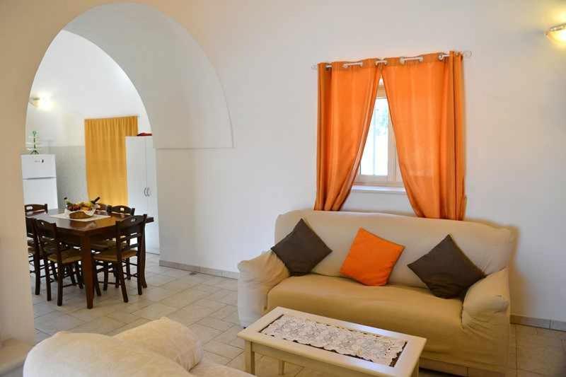 A seating area at Trullo Antico with exclusive swimming pool